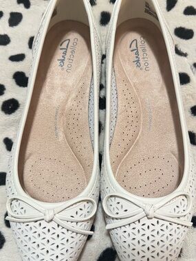 Comfortiva White Laser-Cut Bow Ballet Flats